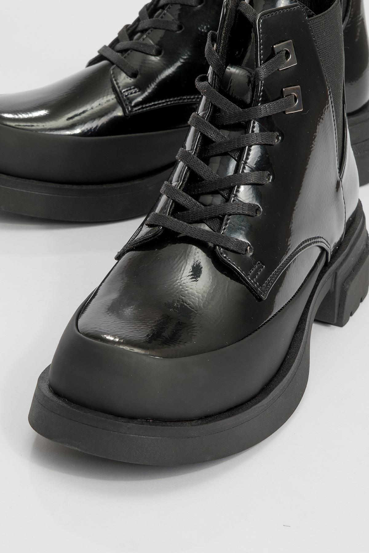 Challo - Bota de combate elástica de charol negro (Mujer)