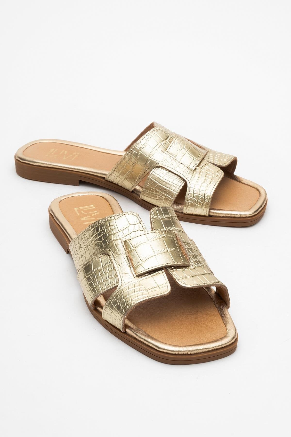 Notre - Sandalia deslizable de cuero dorado (Mujer)