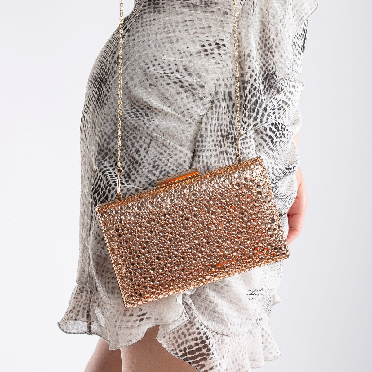Clara - Bolso de mano de lentejuelas oro rosado