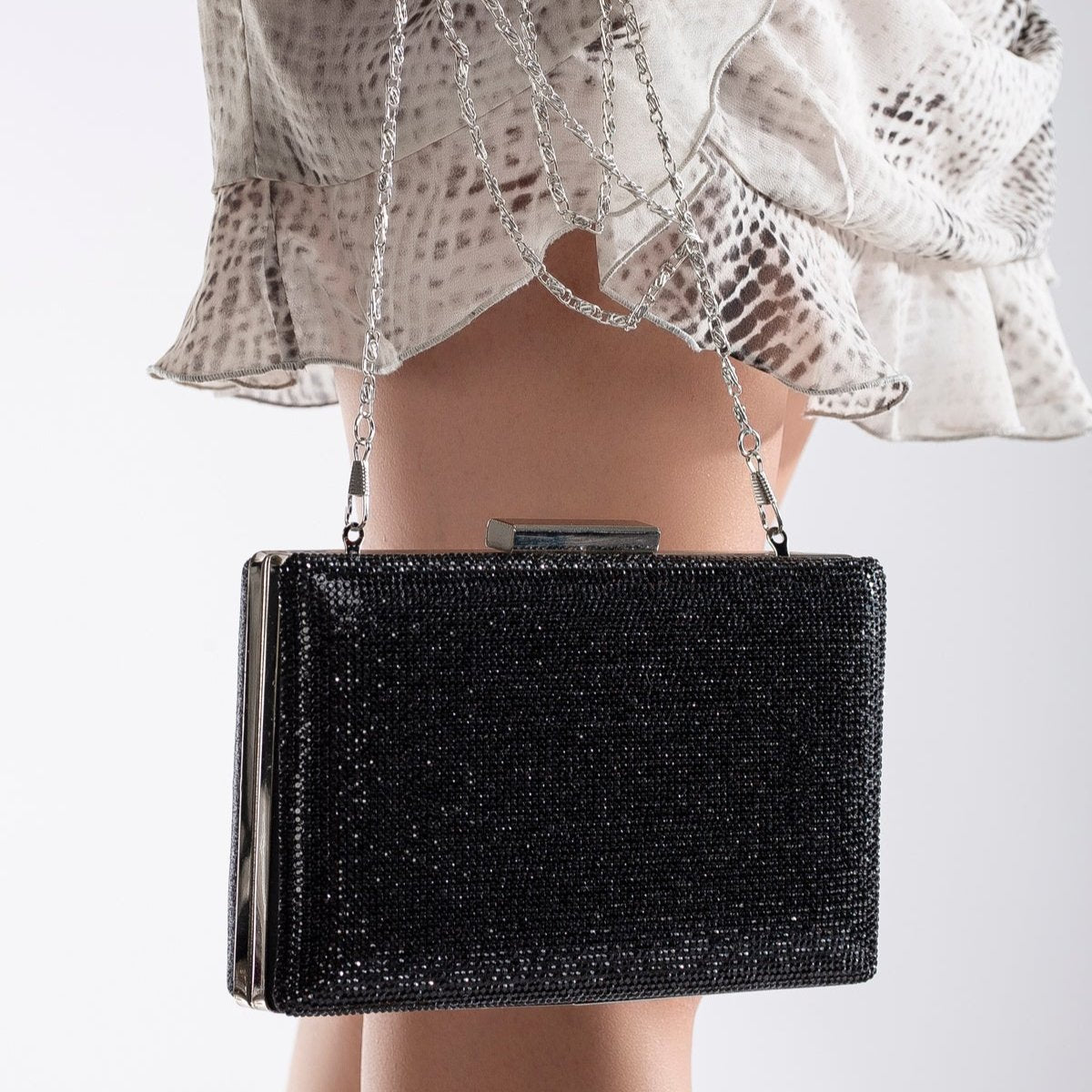 Clara - Bolso de mano de noche negro con purpurina