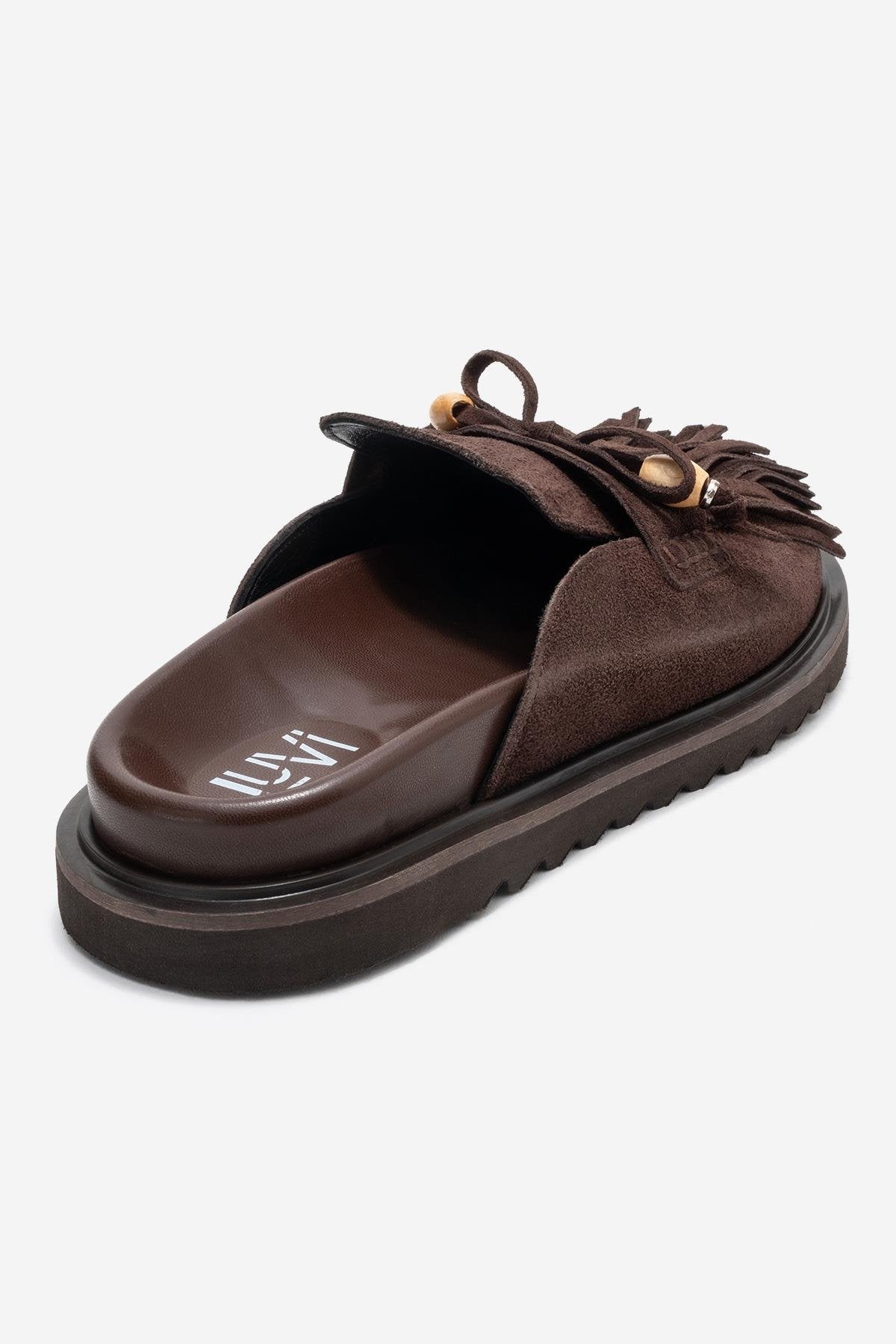 Carol - Mules de cuero de ante marrón con borlas (Mujer)