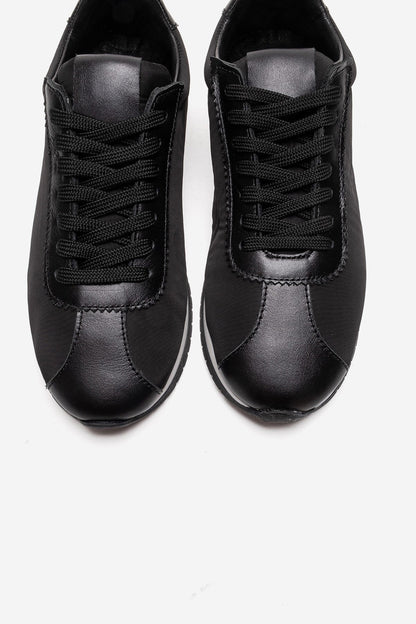 UNICA - Zapatilla deportiva de cuero negro genuino (Mujer)