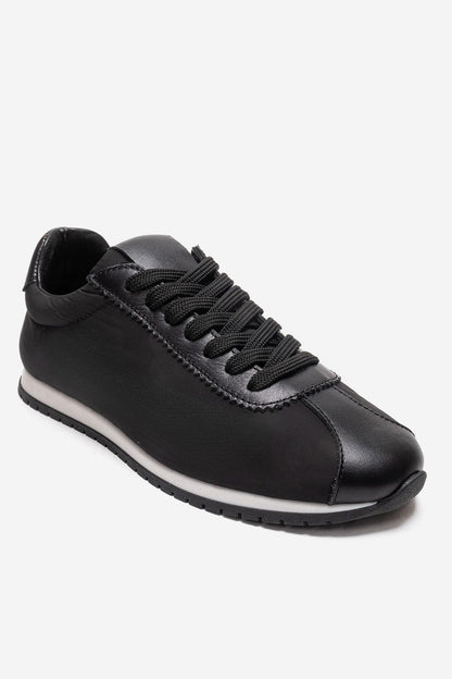 UNICA - Zapatilla deportiva de cuero negro genuino (Mujer)