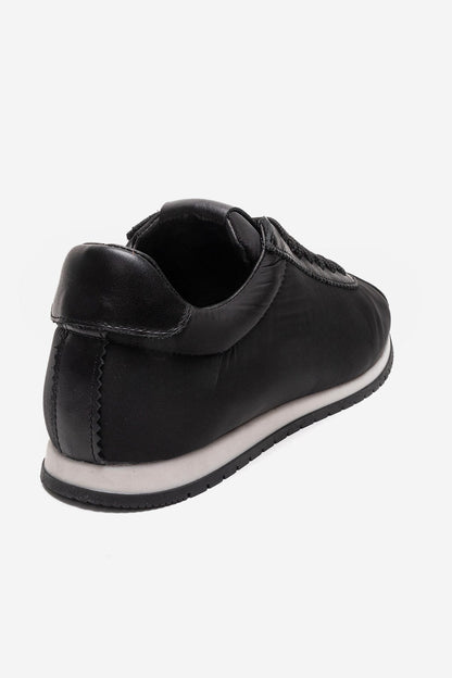 UNICA - Zapatilla deportiva de cuero negro genuino (Mujer)