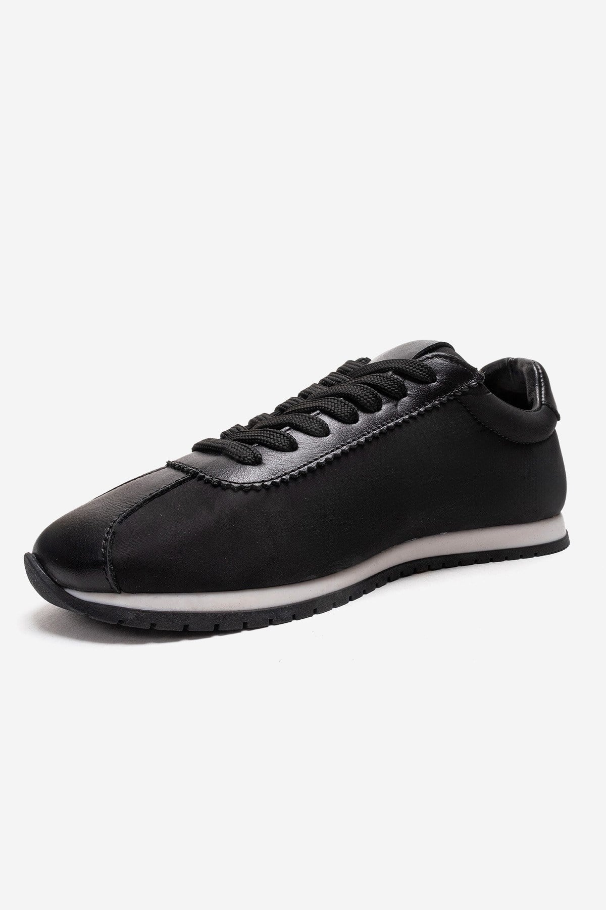 UNICA - Zapatilla deportiva de cuero negro genuino (Mujer)