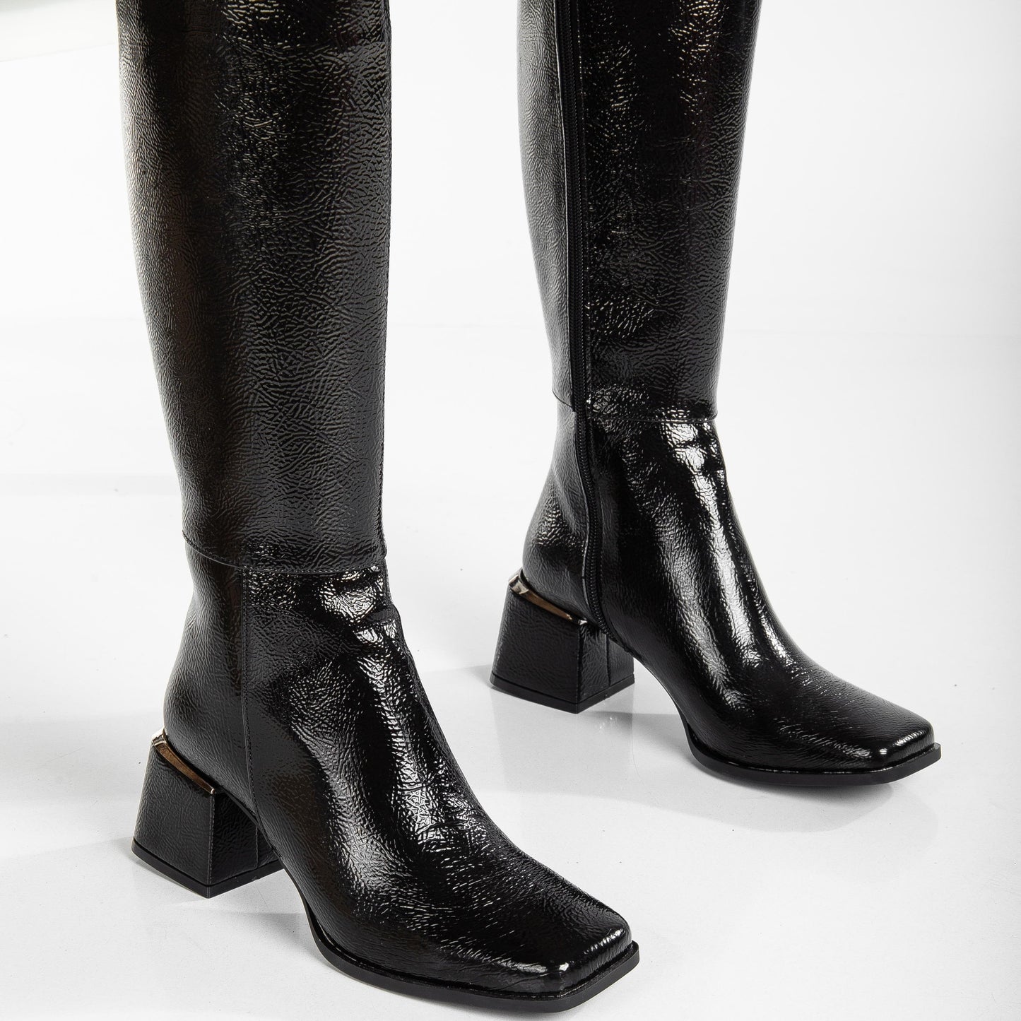 vegan black patent boots, black knee high boots, cruelty-free footwear, eco-friendly fashion, sustainable boots, plant-based patent leather, black vegan boots, non-leather boots, animal-free footwear, ethical fashion, vegan heeled boots, glossy black boots, stylish knee high boots, high heel boots, vegan patent boots, women's vegan footwear