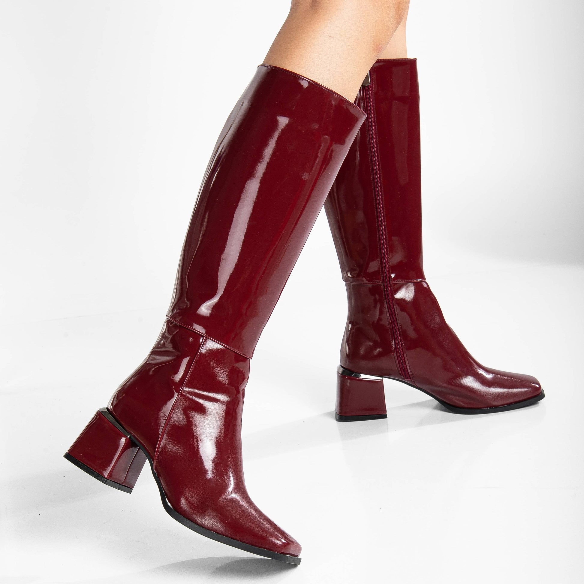 vegan knee high boots, burgundy knee high boots, cruelty-free footwear, eco-friendly fashion, sustainable boots, plant-based leather, burgundy vegan boots, non-leather boots, animal-free footwear, ethical fashion, vegan heeled boots, stylish knee high boots, elegant burgundy boots, high heel boots, vegan leather boots, luxurious vegan boots, women's vegan footwear