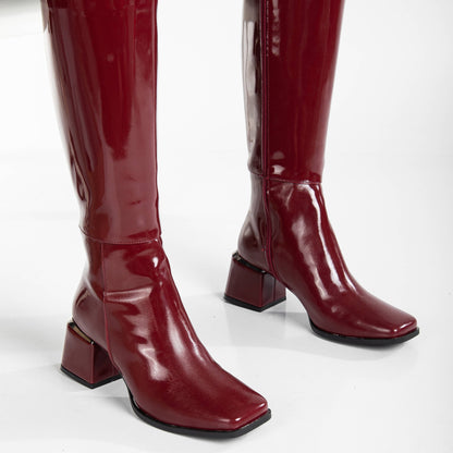vegan knee high boots, burgundy knee high boots, cruelty-free footwear, eco-friendly fashion, sustainable boots, plant-based leather, burgundy vegan boots, non-leather boots, animal-free footwear, ethical fashion, vegan heeled boots, stylish knee high boots, elegant burgundy boots, high heel boots, vegan leather boots, luxurious vegan boots, women's vegan footwear