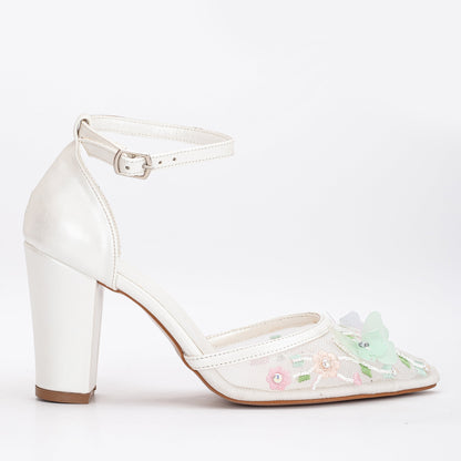 White lace embroidered heels, Embroidered white lace heels, White lace wedding heels with embroidery, Lace bridal heels with embroidery, White lace embroidered pumps, Embroidered lace bridal shoes, White lace heels with floral embroidery, Embroidered lace wedding shoes, White lace heels with intricate embroidery, Lace bridal heels with delicate embroidery.