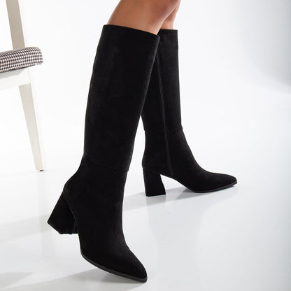 Vegan black knee-high boots, black vegan boots, cruelty-free knee-high boots, sustainable black boots, eco-friendly knee-high boots, vegan leather black boots, women's vegan black boots, stylish black vegan boots, faux leather knee-high boots, black boots for women.