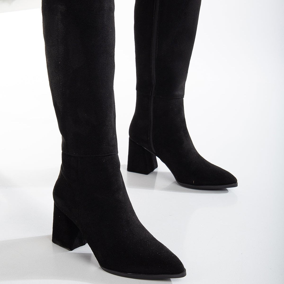 Vegan black knee-high boots, black vegan boots, cruelty-free knee-high boots, sustainable black boots, eco-friendly knee-high boots, vegan leather black boots, women's vegan black boots, stylish black vegan boots, faux leather knee-high boots, black boots for women.