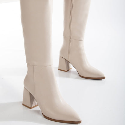 Vegan knee-high boots, beige knee-high boots, sustainable knee-high boots, women's vegan boots, cruelty-free knee-high boots, eco-friendly knee-high boots, vegan leather boots, stylish vegan boots, beige vegan boots, knee-high boots for women.
