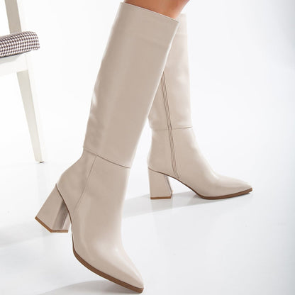 Vegan knee-high boots, beige knee-high boots, sustainable knee-high boots, women's vegan boots, cruelty-free knee-high boots, eco-friendly knee-high boots, vegan leather boots, stylish vegan boots, beige vegan boots, knee-high boots for women.