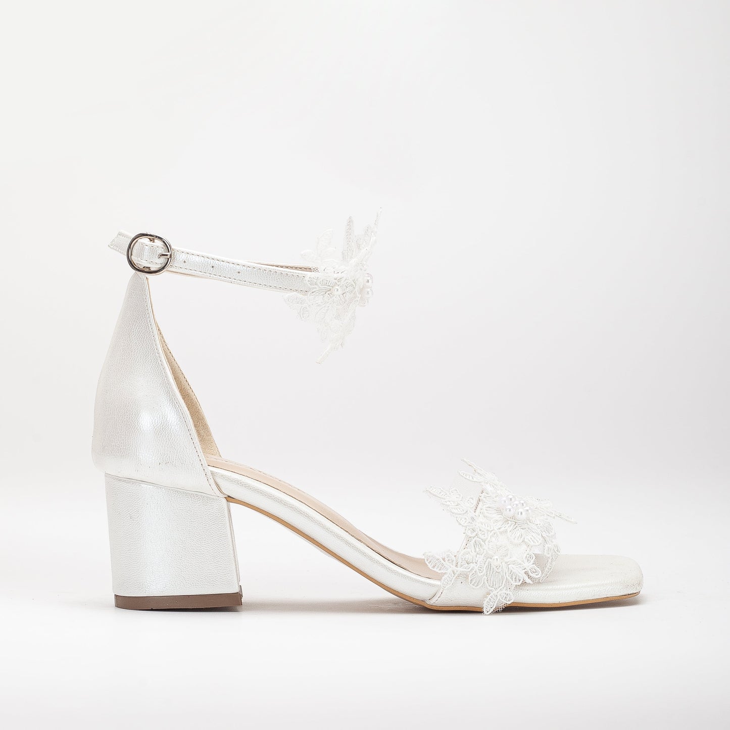 Ivory white shoes with lace on the front, Lace-front ivory white shoes, Ivory white footwear featuring front lace detail, Shoes in ivory white with lace detailing on the front, Front-laced ivory white shoes, Ivory white shoes adorned with lace on the front, Lace-accented ivory white shoes, Ivory white shoes with front lace design, Front lace ivory white footwear, Ivory white shoes with lace embellishment on the front.
