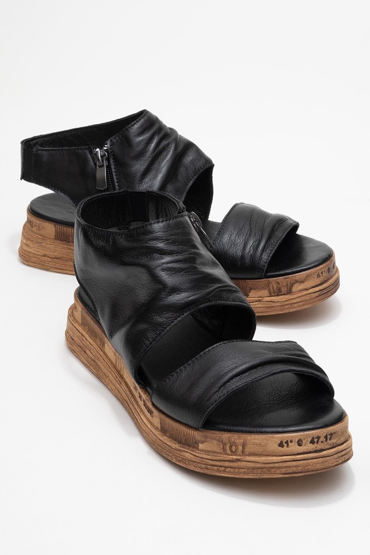Lunas Black Leather Side‑Zip Flat Heel Sandal (Women)