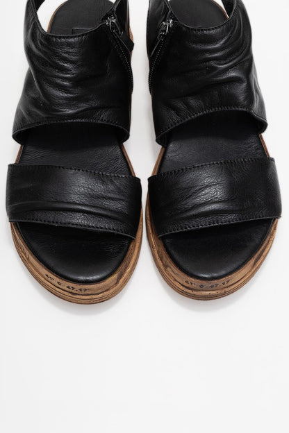 Lunas Black Leather Side‑Zip Flat Heel Sandal (Women)