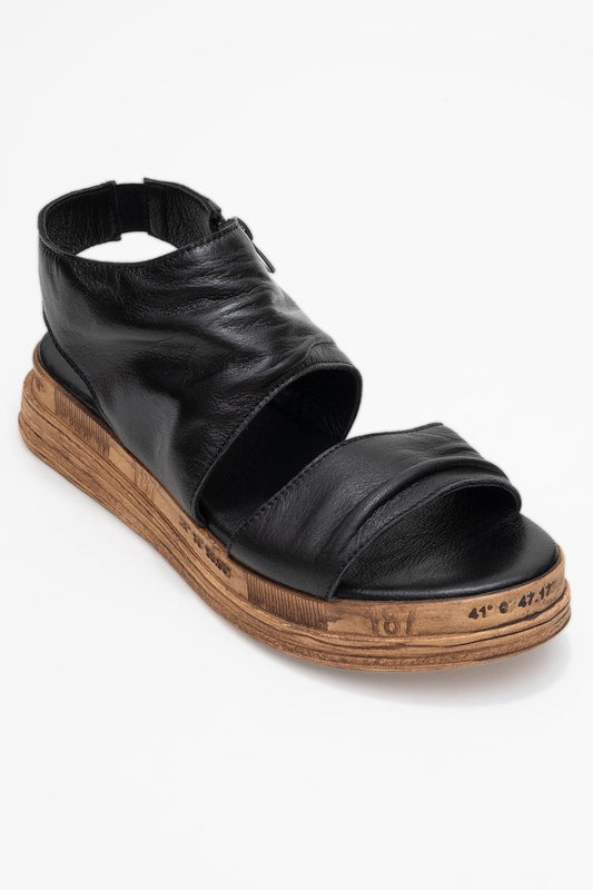 Sandalia Lunas de cuero negro con cremallera lateral y tacón plano (Mujer)