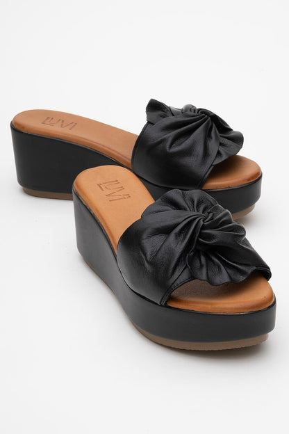 Syndra - Black Bow Wedge Leather Sandal (Women)
